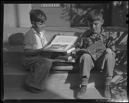 Boys reading on steps, Los Angeles, circa 1935