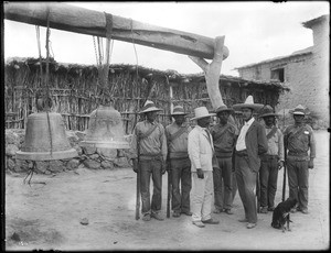 Small group of Mexican soldiers at Torreón, Mexico, beside mission bells, ca.1910