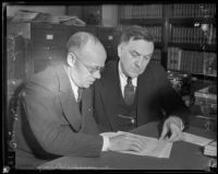 Leon Yankwich and Daniel Beecher examine threat note, Los Angeles, 1934