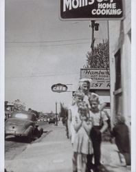 Georgiane Geving in front of Mom's Cafe, 605 Third Street, Petaluma, California, 1947