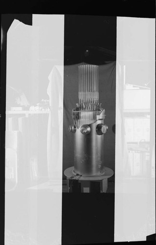 Cutaway nuclear reactor display model with control rods raised