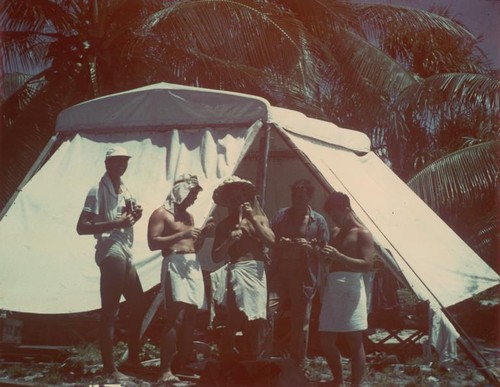 Bikini Island's "Little Petunia" encampment. Left to right: Edward Barr, Bob Dill, Dean Carlson, George Brayton, Wayne Runyon. Midpac Expedition, September 1950