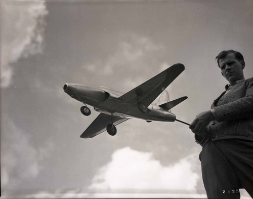 Man holds model airplane