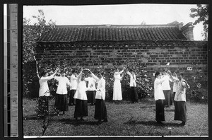 Students dancing in a garden, Nanjing, Jiangsu, China, ca.1915