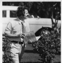 Phillip Isenberg, Sacramento City Councilman, Mayor, Assemblymember. He is shown as candidate for mayor, walking while reading paperwork