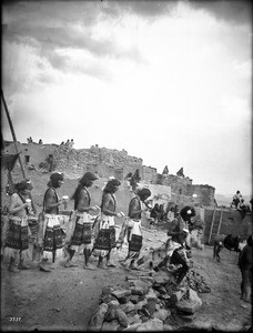 Antelope priests leaving their kiva enroute to the Hopi Snake Dance Ceremony, Oraibi, Arizona, ca.1898