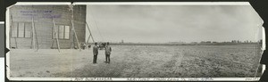 Two men outside the Pony blimp hangar, taken in April 1920