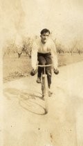 Clyde Arbuckle on bicycle