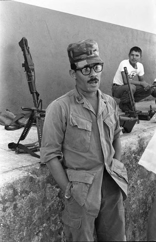 A U.S. military advisor leans on a ledge, Ilopango, 1983