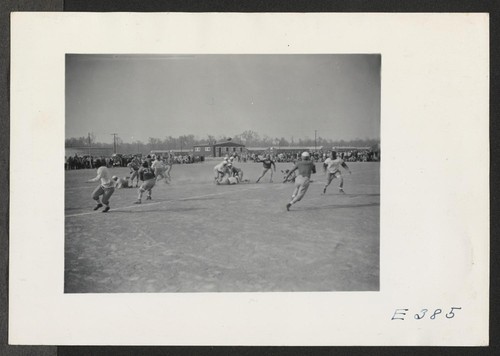 A view of the football crowd at a game between teams representing Stockton and Santa Anita Assembly Centers. Photographer: Parker, Tom McGehee, Arkansas