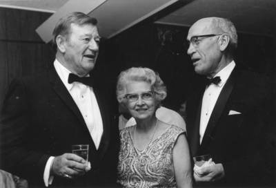 John Wayne with Mrs. and Mr. Arnold Beckman at the Chapman College Challenge '70 dinner