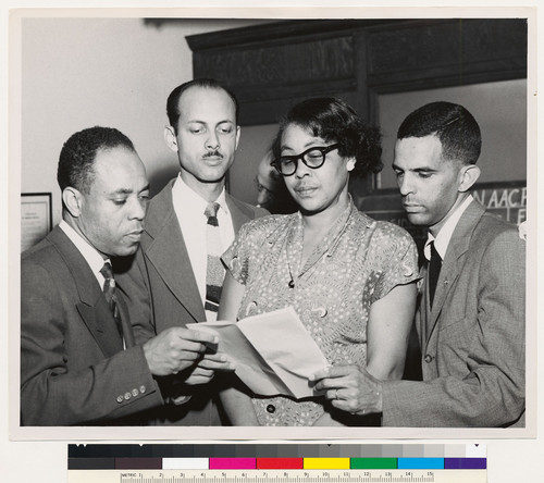 Franklin H. Williams (right) with 3 unidentified people