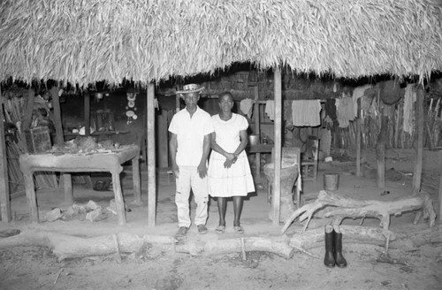 Couple standing under a porch, San Basilio de Palenque, 1976