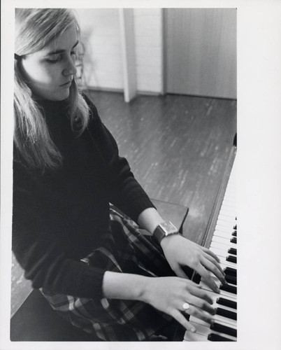 Woman plays piano, Scripps College
