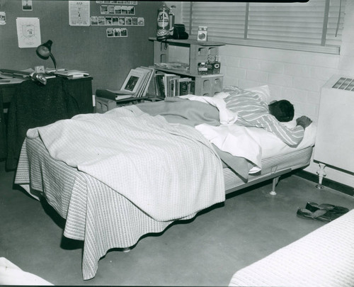Student in bed, Claremont McKenna College