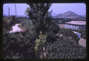 village with houses in the foreground and mountains in the background
