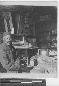 A cloth merchant at Xinbin, China, 1936