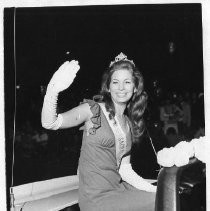 Joyce Garcia, Miss Metropolitan Sacramento, waving to people from car in parade