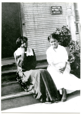 Maggie Watts and Frances Watts Kemper sitting in front of Dr. William Watts’ office, Houston, Texas