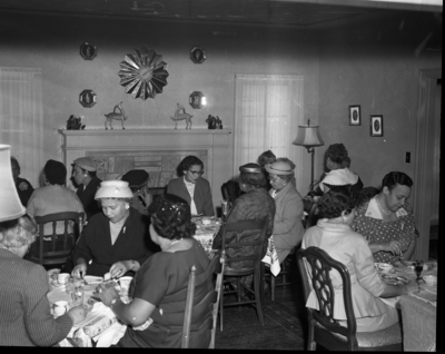 Group of women seated at dining tables