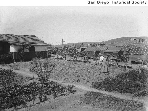 A women working in a garden at the Little Landers Colony