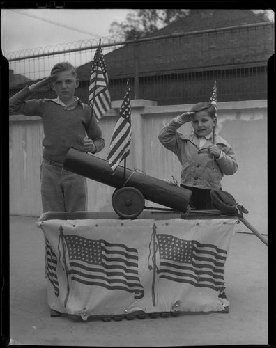 Boys saluting, with flags and cannon, Los Angeles, circa 1935
