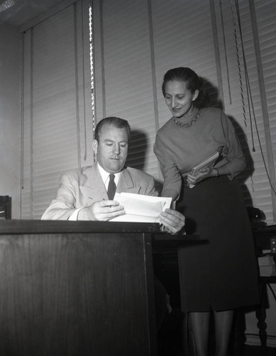President Tiner at desk with secretary