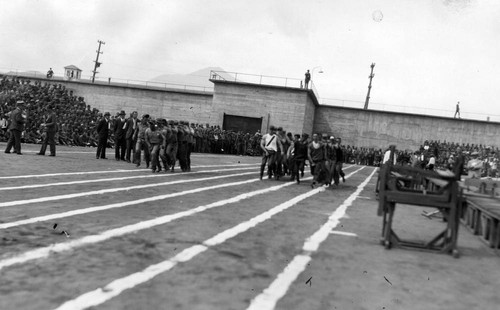 Centipede race (front view), San Quentin Little Olympics Field Meet, 1930 [photograph]