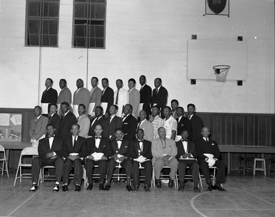 Group photograph of masons in basketball gym