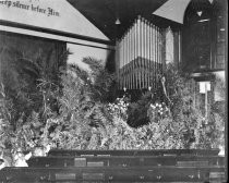 Church interior decorated with plants, c. 1912