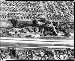 Aerial view of housing tracts in Sherman Oaks, showing the McKinley Home for Boys, 1960