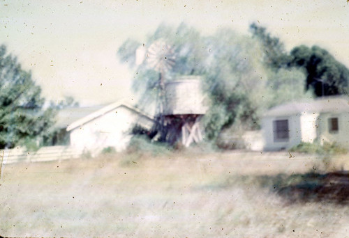Farm house and windmill on W. 17th Street in 1964