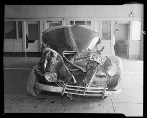 1940 Pontiac sedan and scenes of accident on Rosecrans Avenue, Southern California, 1940