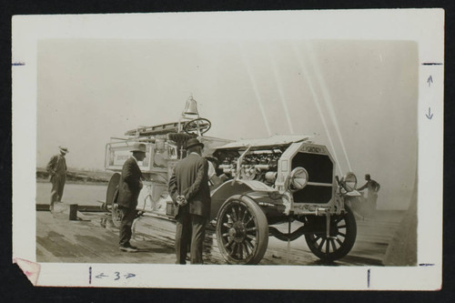 Men inspecting a fire engine