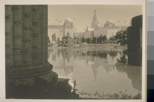 H243. [Aisle of Sunset, between Palace of Food Products (left) and Palace of Education (right), distance; Tower of Jewels in far distance. From colonnade, Palace of Fine Arts.]