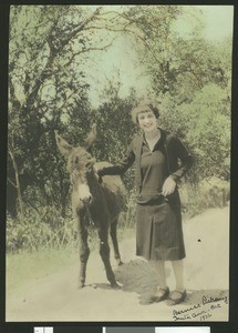 Bernice Pickering with a burro in Santa Ana, 1926