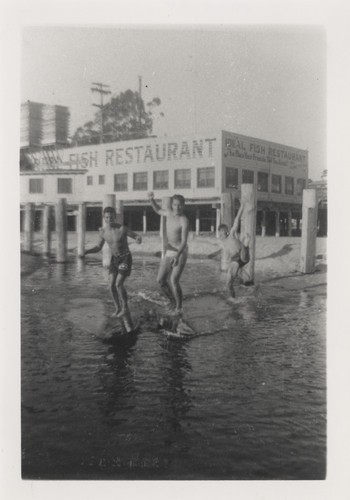Harry Murray, Duane Polly, and Don McNear in front of Ideal Fish Restaurant
