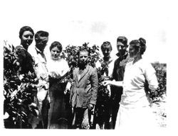 Barlow family standing in berry patch on Barlow Ranch in Sebastopol, about 1910