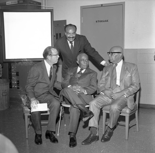 Gilbert Lindsay, Kenneth Hahn, and Col. Leon H. Washington, Jr. talking at the Kearny Post Office opening, Los Angeles, 1972