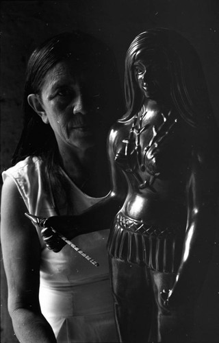 Woman and a statue, La Chamba, Colombia, 1975