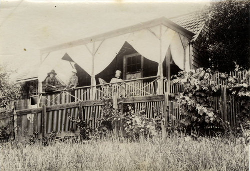 Visitors in front of a cottage at the Blithedale Hotel, Mill Valley, circa 1889 [photograph]