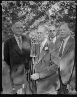 John Steven McGroarty at a microphone with Albert I Stewart, Robert M. Clark and Bernard Brenner at a Brookside Park picnic, Pasadena, 1935
