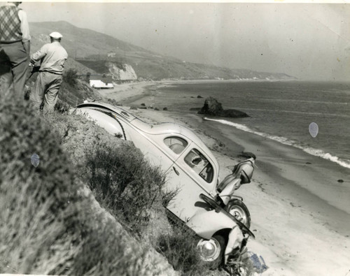 Car on beach embankment following traffic accident, 1946