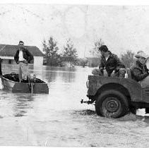 Jeep and Boat in Flood Water