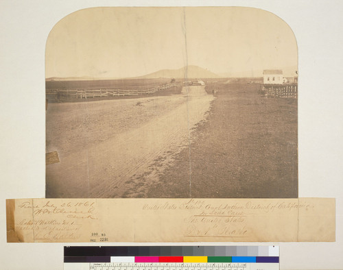 [Rancho San Antonio: view looking north along old County Road with building at right.]