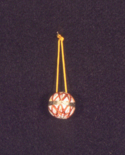 Miniature temari thread ball with gold band