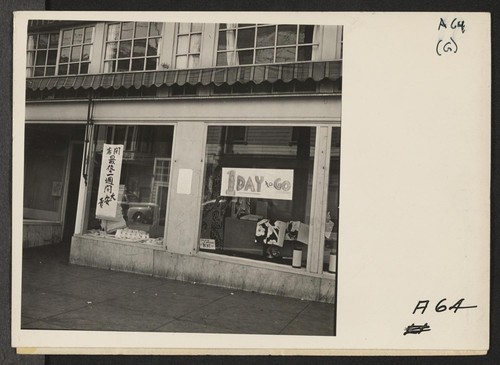 Shortly before evacuation of persons of Japanese ancestry from the Post and Buchanan Streets neighborhood, San Francisco. This dry goods store is closing out its merchandise. Evacuees will be housed in War Relocation Authority centers for duration. Photographer: Lange, Dorothea San Francisco, California