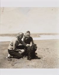 Mary McGregor and a girl named Tatiana playing with a dog at the beach, about 1938