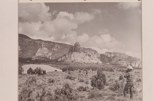Sandstone butte on Rainbow Mesa near foot of Navajo Mountain. Bill Belknap with the camera at right
