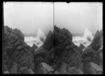 Stereoscopic image of Pacific waves crashing against rocks
